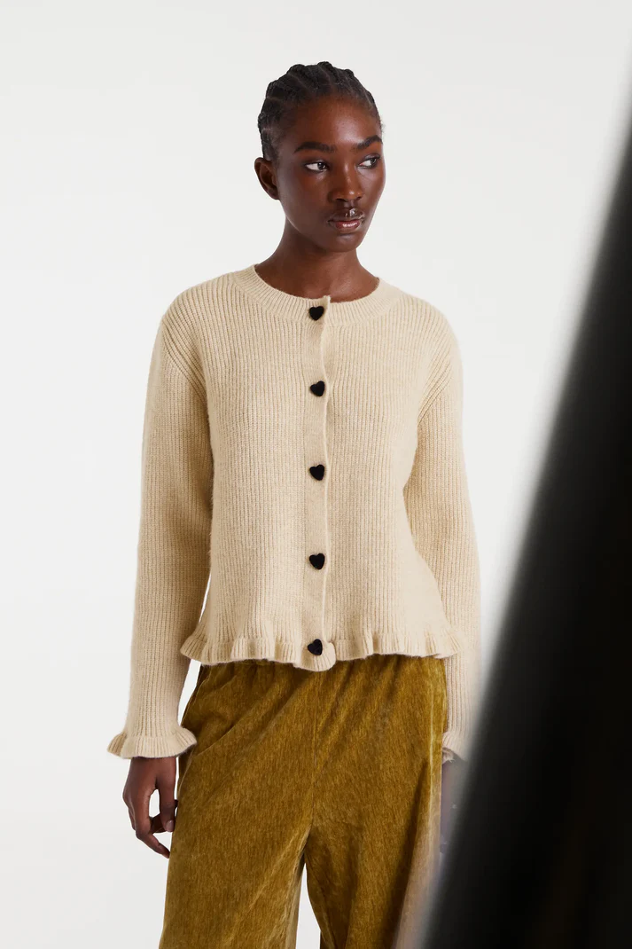 CÁRDIGAN CON VOLANTE BAJO